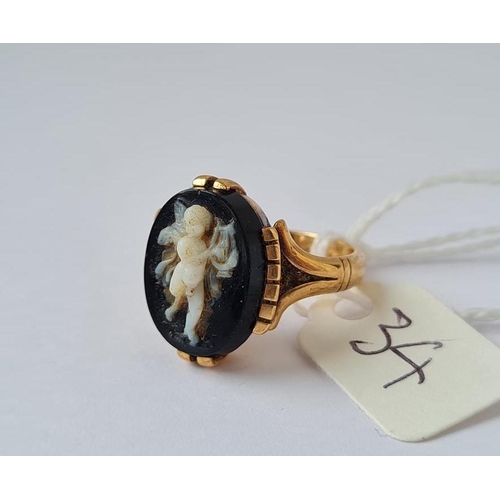 34 - A gold and hardstone cherub ring size L 6.6g inc