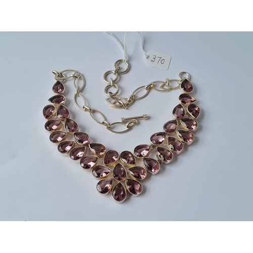 370 - A multi stoned purple pear drop stone (amethyst?) necklace mounted in white metal