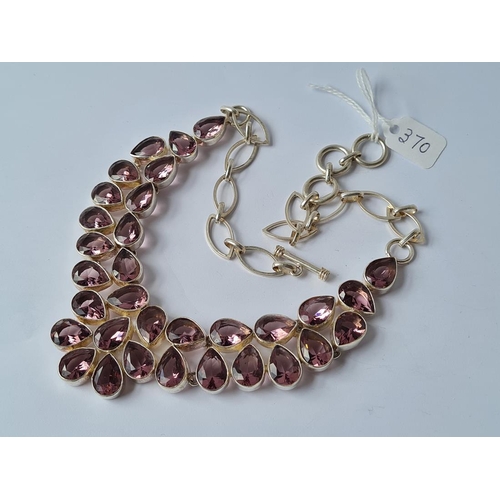 370 - A multi stoned purple pear drop stone (amethyst?) necklace mounted in white metal