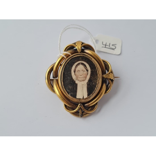 415 - A Victorian knot design gilt mourning photo brooch with hair locket