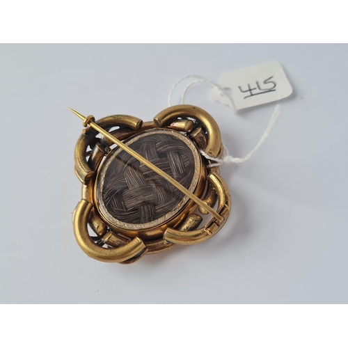 415 - A Victorian knot design gilt mourning photo brooch with hair locket