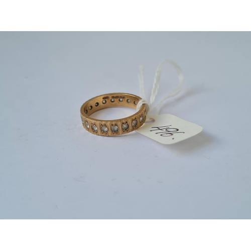 496 - A stone set eternity ring in 9ct size R 3.7g