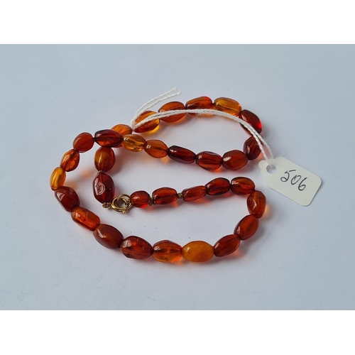 506 - A vintage amber bead necklace