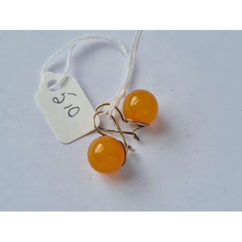 510 - An Indian 21ct gold on silver amber earrings