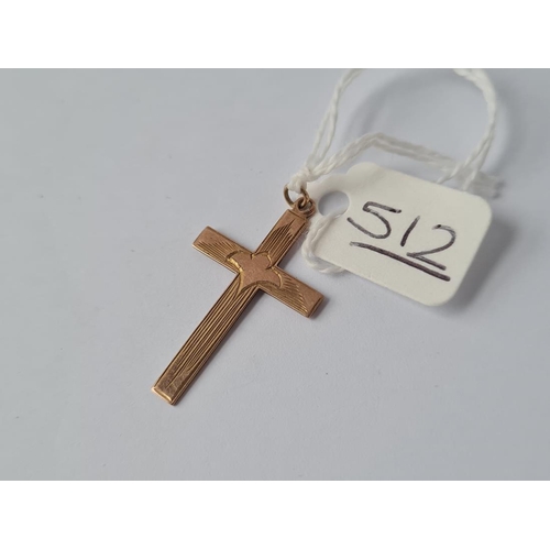 512 - An engraved cross pendant in 9ct - 1.1gms