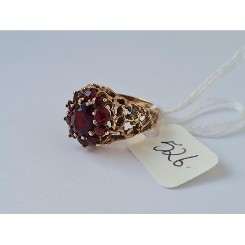 526 - Garnet cluster ring in 9ct pierced mount size O 5.2g inc