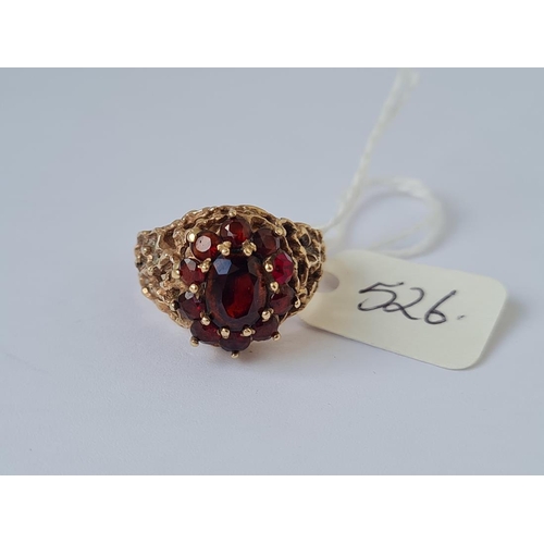 526 - Garnet cluster ring in 9ct pierced mount size O 5.2g inc