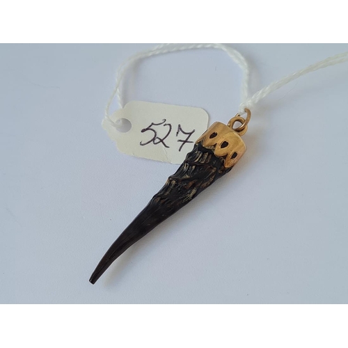 527 - A horn pendant with 9ct gold mount