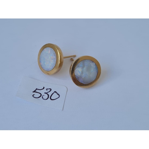 530 - A pair of circular opal earrings in 9ct mounts 4.1g