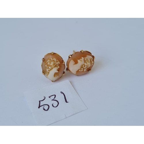 531 - A pair of carved cameo earrings in 9ct mounts