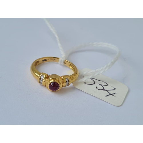 534 - A cabochon ruby ring with diamond shoulders in 18ct gold size I 3g