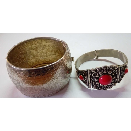 204 - Two white metal Easteren cuff bangles