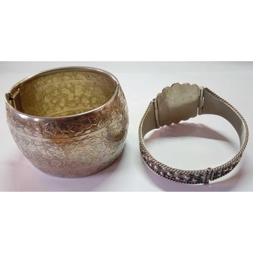 204 - Two white metal Easteren cuff bangles