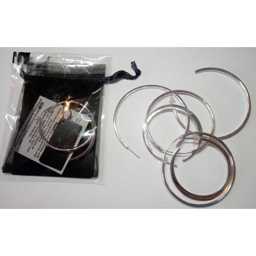 208 - Four pairs of silver hooped earrings