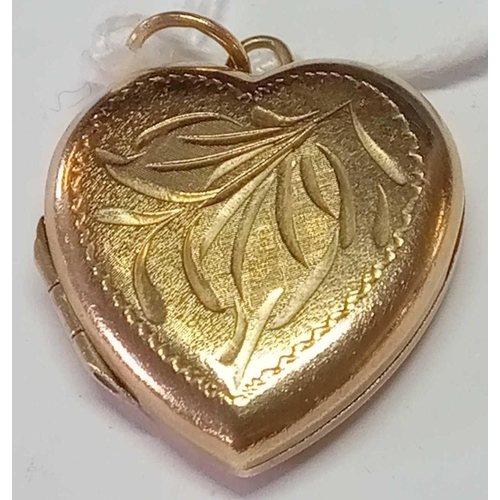 210 - A heart engraved locket in 9ct
