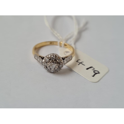419 - A diamond cluster ring in 18ct gold & platinum - size M - 2.8gms