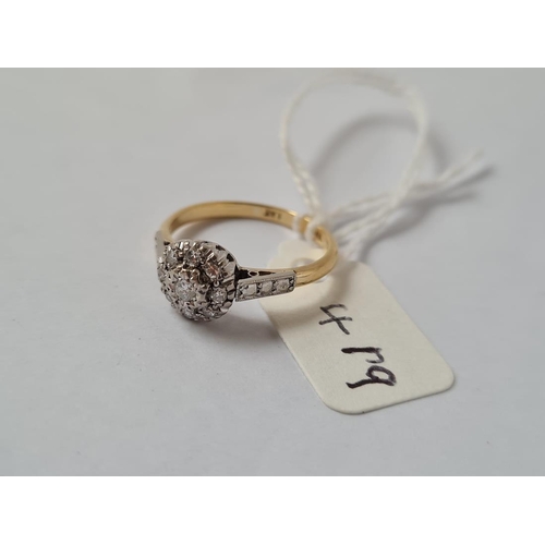 419 - A diamond cluster ring in 18ct gold & platinum - size M - 2.8gms
