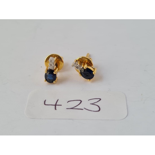 423 - A pair of diamond & sapphire earrings set in 18ct gold