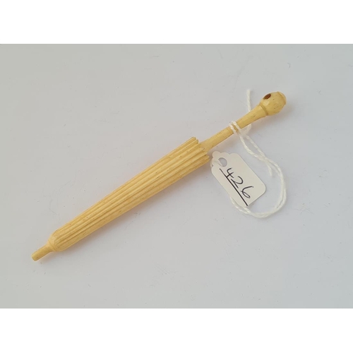 426 - A carved needle case in the form of an umbrella