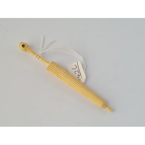 426 - A carved needle case in the form of an umbrella