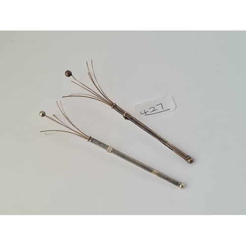 427 - Two silver swizzle sticks