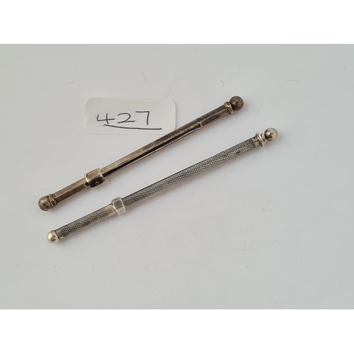 427 - Two silver swizzle sticks