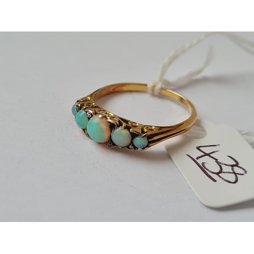 438 - A 5 stone opal & diamond ring set in gold - size P - 2.8gms
