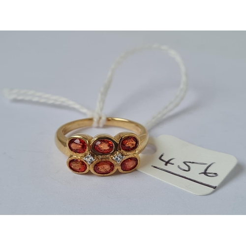 456 - A oval cut orange sapphire dress ring in 9ct Gold - size N - 3.90grms