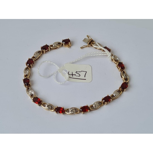 457 - A garnets & diamonds bracelet 5.50ct (marked 375 & DIA) in 9ct Gold 10.40grms