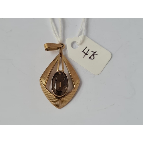 475 - An 8ct gold citrine pendant