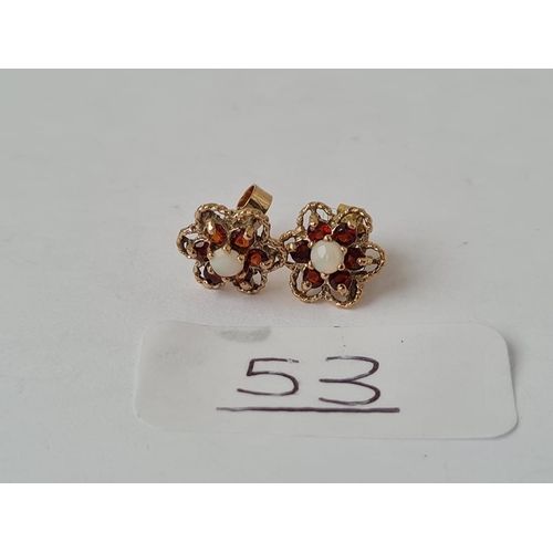 53 - A pair of opal & garnet stud earrings in 9ct - hallmarked on stems