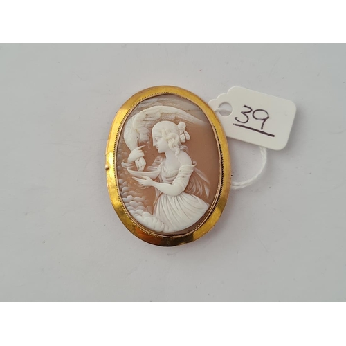39 - A cameo of a girl and bird in 9ct