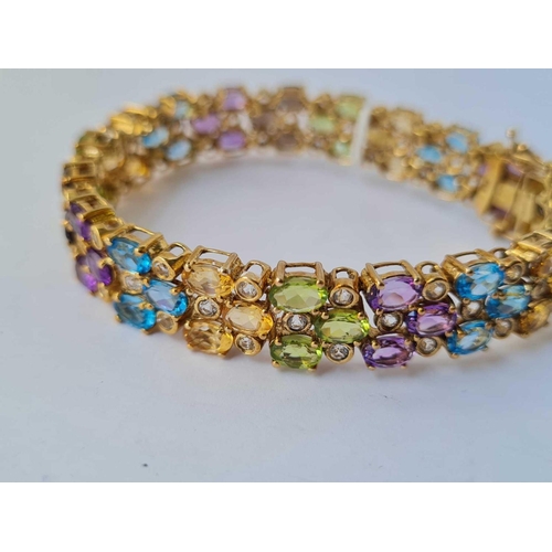 10 - A very attractive silver gilt multi colour stone bracelet