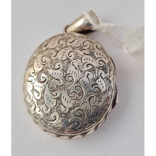 111 - A antique Victorian hallmarked locket with scrolled decoration to front