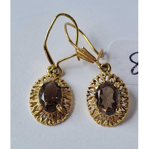 82 - A pair of 9ct smoky quartz drop earrings
