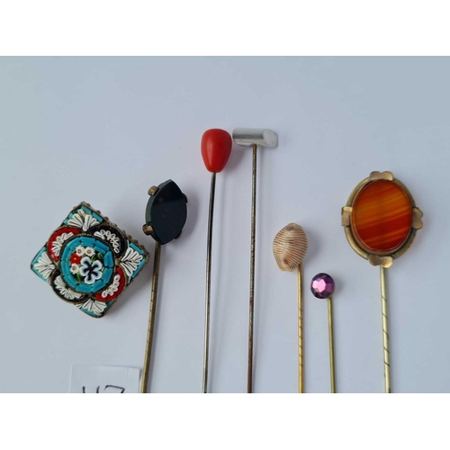 117 - Bag containing vintage stick pins and a Millefiori brooch