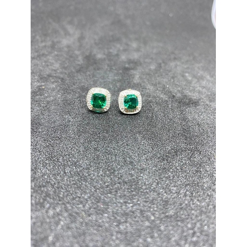 123 - A pair of green diopside and diamond cluster earrings set in gold