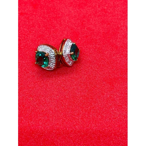 123 - A pair of green diopside and diamond cluster earrings set in gold