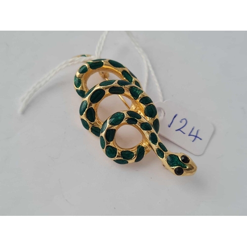 124 - A enamel gilt coiled snake brooch with gem set eyes