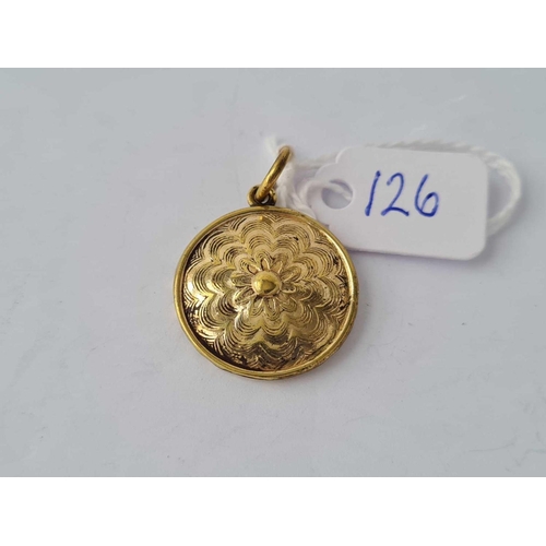 126 - A early Victorian circular glass fronted hair locket / pendant set in gold