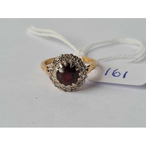 161 - A garnet and diamond cluster ring 18ct gold size M -4 gms