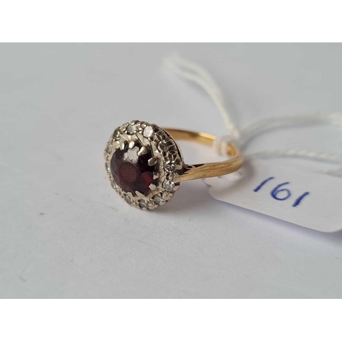 161 - A garnet and diamond cluster ring 18ct gold size M -4 gms