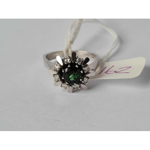 162 - A WHITE GOLD TOURMALINE AND DIAMOND CLUSTER RING MARKED 538 IN SHANK BUT WILL GUARANTEE AT LEAST 12C... 