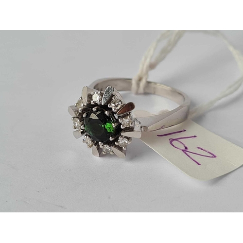 162 - A WHITE GOLD TOURMALINE AND DIAMOND CLUSTER RING MARKED 538 IN SHANK BUT WILL GUARANTEE AT LEAST 12C... 