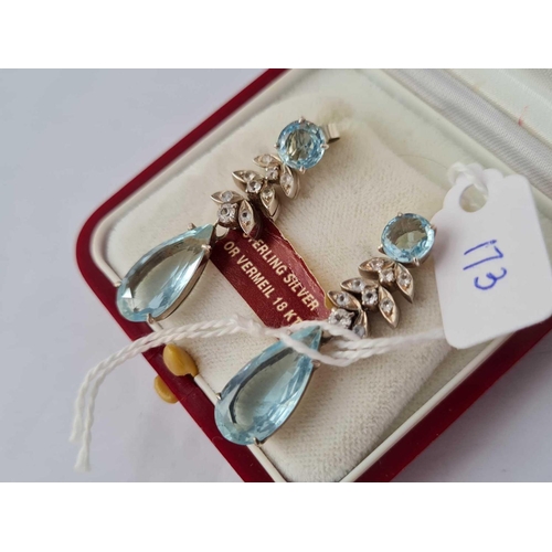 173 - A pair of fancy silver blue stone drop earrings