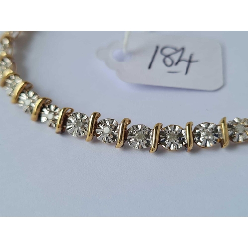 184 - A diamond set 9ct line bracelet with full hall marks 6.4g inc