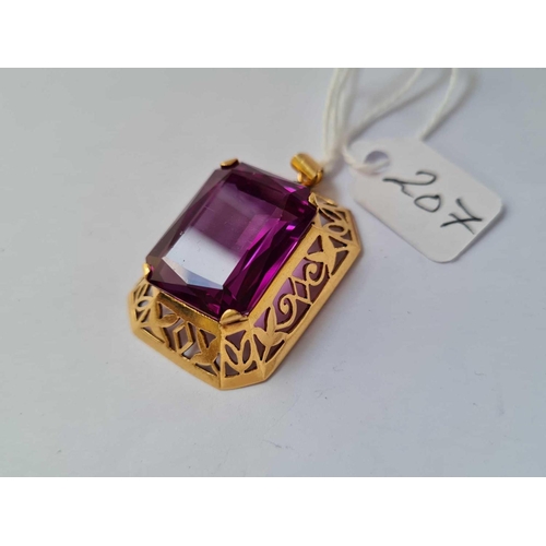 207 - A large gold mounted rectangular  purple stone pendant 13.8g inc