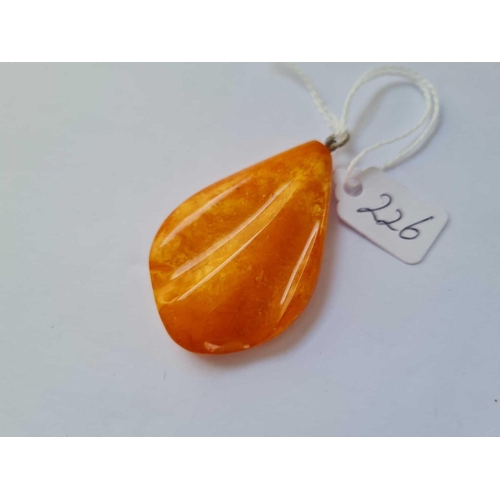 226 - A large butterscotch amber pendant 5 cm long 7.7g