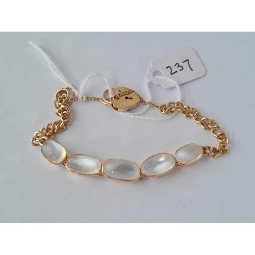 237 - 9CT GOLD BRACELET SET WITH 5 MOONSTONES WITH A PADLOCK FASTENING.