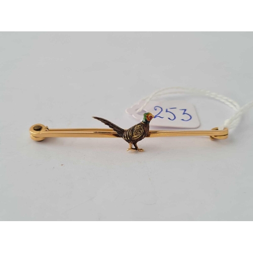 253 - A attractive bar brooch with gold and enamel pheasant with ruby eye 15 ct gold - 4.6 gms